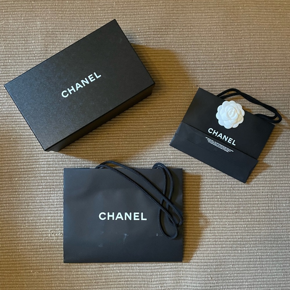 Collection of authentic Chanel bags and box